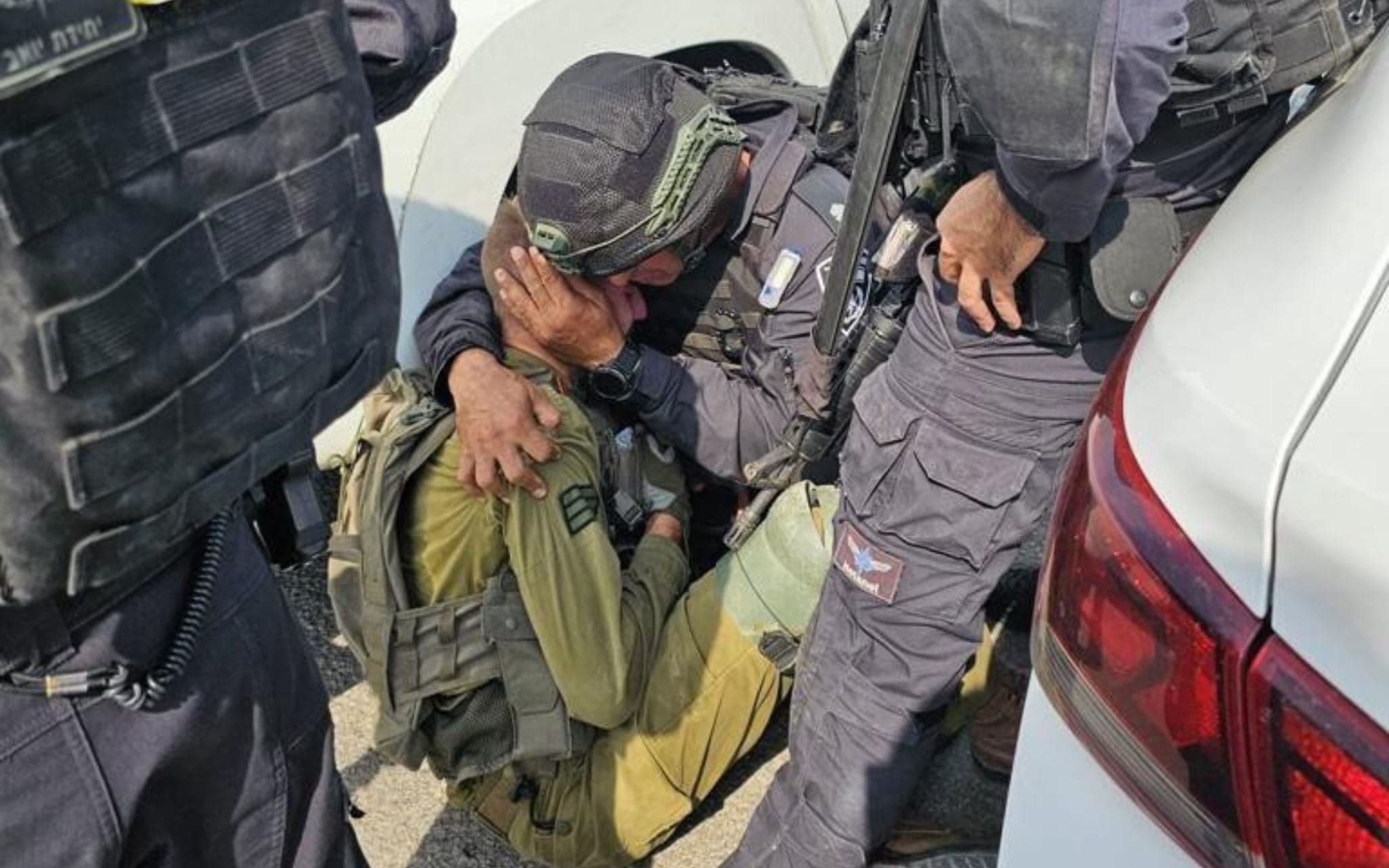 A soldier comforted in the field